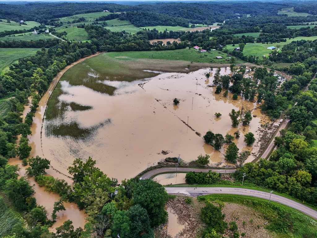 Remaining floodwater covers a portion of Roseville, Ohio, Wednesday, Aug. 12, 2026. (AP Photo/Gene J. Puskar)