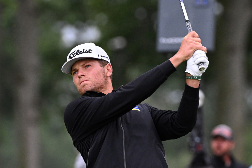 Michael Brennan hits from the fifth tee during the final round of the Rocket Classic golf tournament Sunday, Aug. 2, 2026, in Detroit. (AP Photo/Jose Juarez)
