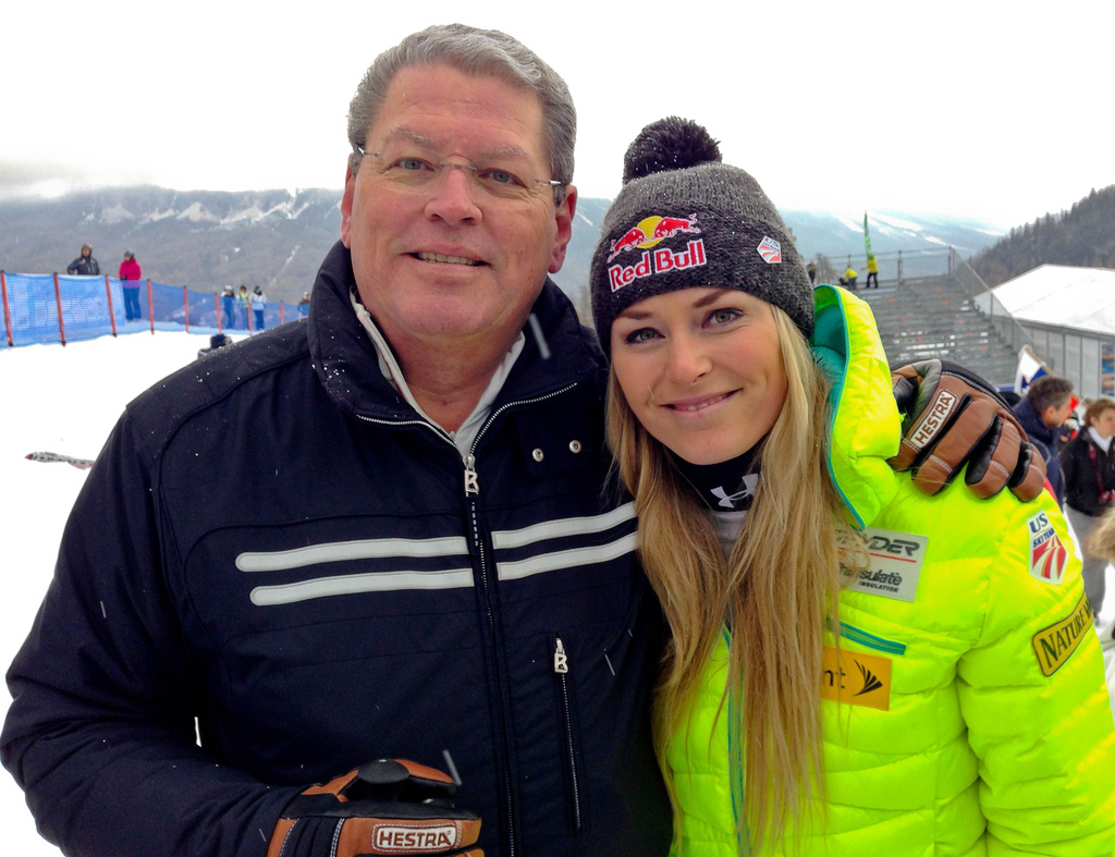 FILE - United States' Lindsey Vonn, right, poses for photographs with her father Alan Kildow at the end of an alpine ski, women's World Cup downhill race, in Cortina d'Ampezzo, Italy, Friday, Jan. 16, 2015. (AP Photo/Andrew Dampf, File)