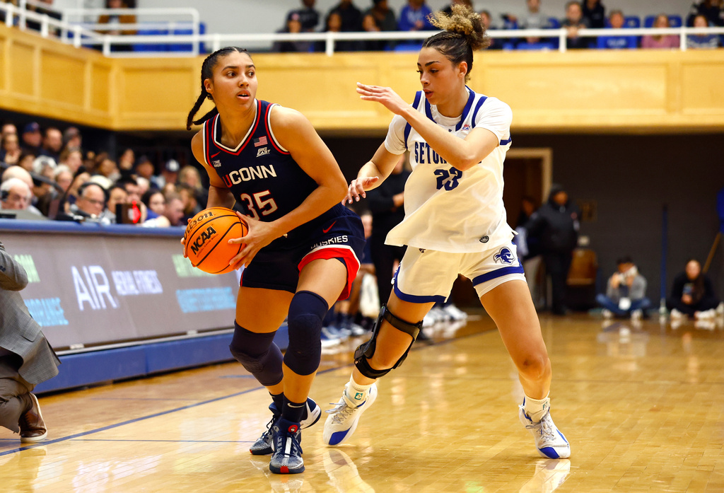 UConn guard Azzi Fudd (35) drives to the basket against Seton Hall guard Jordana Codio (23) during the first half of an NCAA college basketball game, Saturday, Jan. 24, 2026, in South Orange, N.J. (AP Photo/Noah K. Murray)