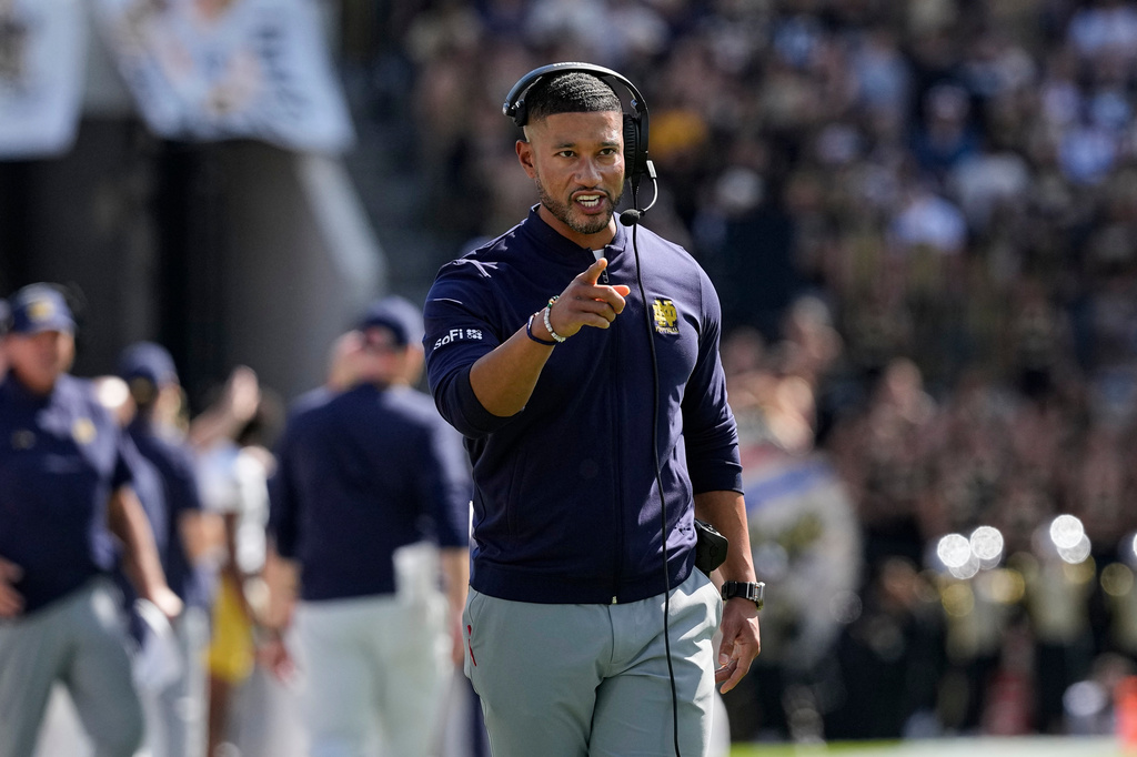 Notre Dame head coach Marcus Freeman gestures after Notre Dame scored a touchdown against the Purdue during the first half of an NCAA college football game in West Lafayette, Ind., Saturday, Sept. 26, 2026. (AP Photo/Michael Conroy)