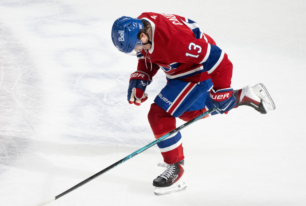 Montreal Canadiens' Cole Caufield (13) celebrates his game-winning goal over the Nashville Predators during overtime NHL hockey action in Montreal on Thursday, Oct. 16, 2025. (Christinne Muschi/The Canadian Press via AP)