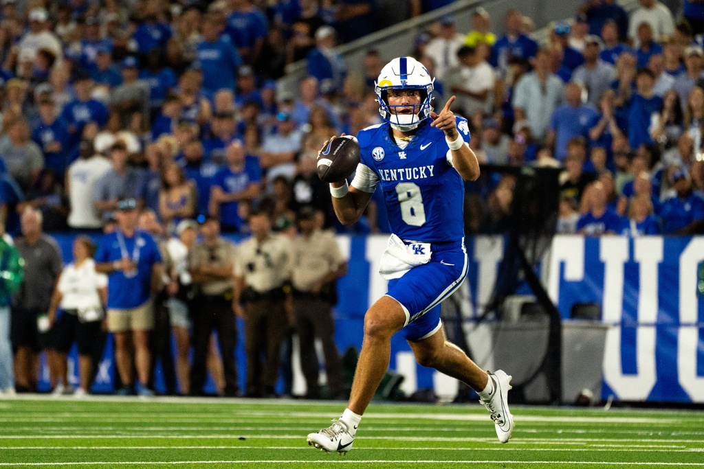 Kentucky quarterback Cutter Boley points to a receiver in the first quarter of an NCAA college football game against Eastern Michigan, Saturday, Sept. 13, 2025, in Lexington, Ky. (AP Photo/Michael Swensen)