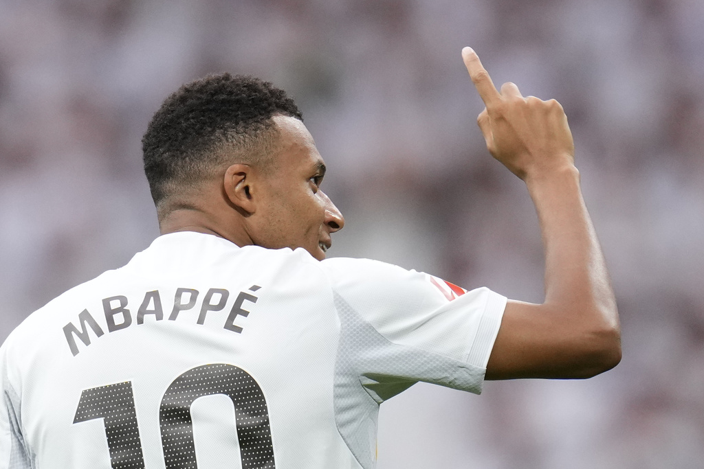 Real Madrid's Kylian Mbappe celebrates after scoring his side's second goal during the Spanish La Liga soccer match between Real Madrid and Espanyol at the Santiago Bernabeu stadium in Madrid, Spain, Saturday, Sept. 20, 2025. (AP Photo/Manu Fernandez)