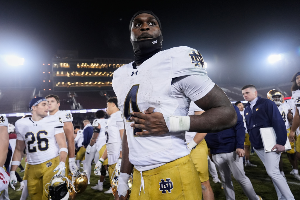 FILE - Notre Dame running back Jeremiyah Love (4) walks off the field after an NCAA college football game against Stanford, Saturday, Nov. 29, 2025, in Stanford, Calif. (AP Photo/Godofredo A. Vásquez, File)