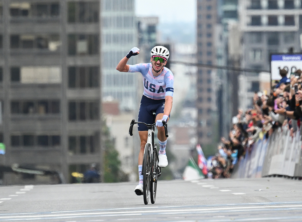 Brandon McNulty, of the United States, celebrates winning the men's elite road race at the UCI Road World Championships cycling event in Montreal, Sunday, Sept. 27, 2026. (Graham Hughes/The Canadian Press via AP)