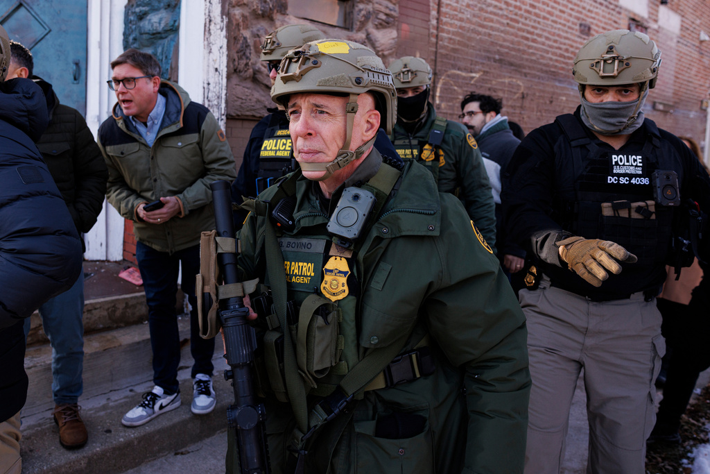 Border Patrol Cmdr. Gregory Bovino walks alongside his agents after they detain an individual near West 27th Street and South Ridgeway Avenue in the Little Village neighborhood of Chicago, Tuesday, Dec. 16, 2025. (Anthony Vazquez/Chicago Sun-Times via AP)