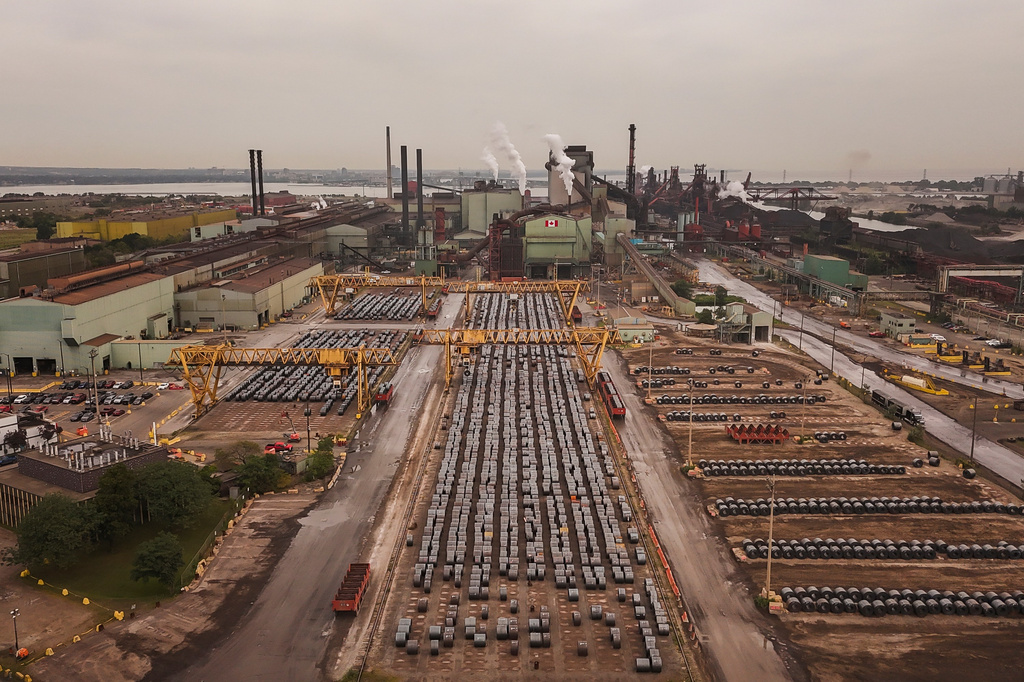 Rolled coils of steel sit in the yard at the ArcelorMittal Dofasco steel plant in Hamilton, Ont. on Thursday, Aug. 20, 2026. (Nick Iwanyshyn /The Canadian Press via AP)