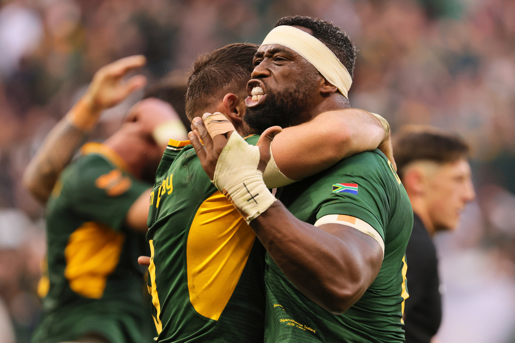 South Africa's captain Siya Kolisi celebrates with his teammate after scoring a try during a second Test rugby match between South Africa and New Zealand, in Cape Town, South Africa, Saturday, Aug. 29, 2026. (AP Photo/Halden Krog)