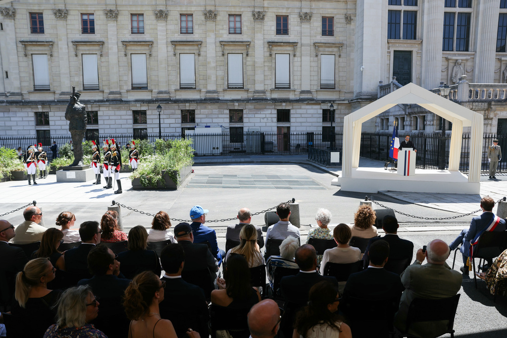 France's President Emmanuel Macron delivers a speech during a tribute ceremony to Captain Alfred Dreyfus on the first national day dedicated to the recognition of his innocence by the Court of Cassation in 1906, and the fight against the resurgence of antisemitism, 120 years later, on the Ile de la Cite near the Cour de Cassation in Paris, Sunday, July 12, 2026. (Thomas Samson/Pool Photo via AP)
