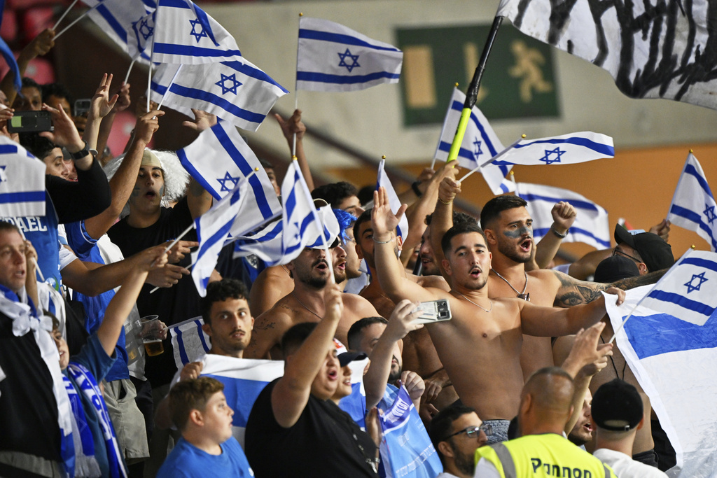 Israel fans cheer their team ahead of a Group I, World Cup qualifier soccer match between Israel and Italy at the Nagyerdei Stadium in Debrecen, Hungary, Monday, Sept. 8, 2025. (AP Photo/Denes Erdos)