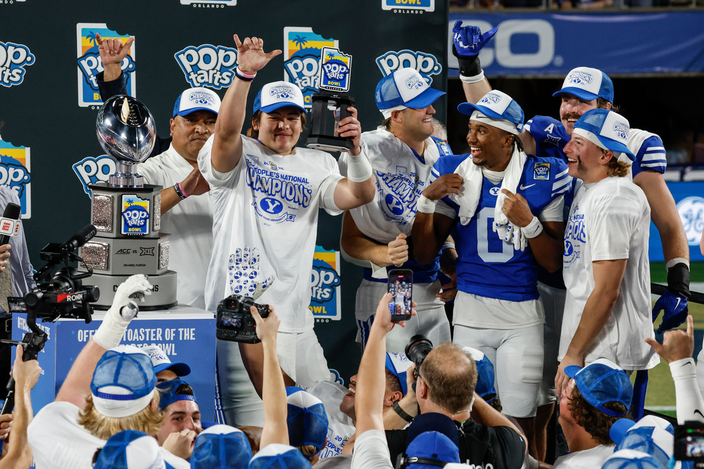 BYU quarterback Bear Bachmeier, holds the MVP award after defeating Georgia Tech in the Pop-Tarts Bowl NCAA college football game, Saturday, Dec. 27, 2025, in Orlando, Fla. (AP Photo/Kevin Kolczynski)