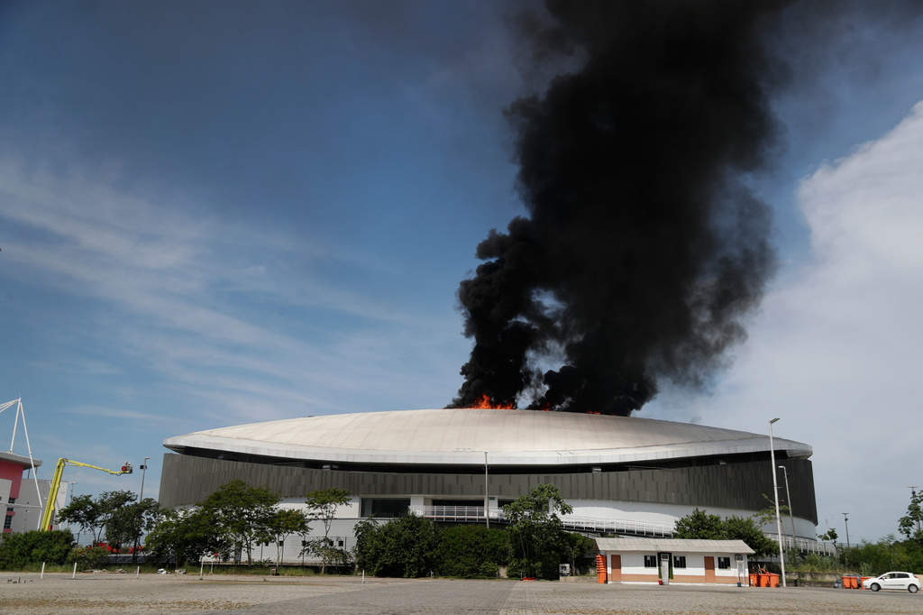The roof of Rio de Janeiro's Olympic Park velodrome is on fire, Wednesday, April 8, 2026. (AP Photo/Bruna Prado)