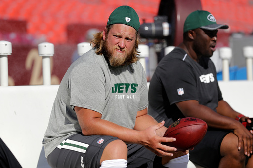 FILE - New York Jets center Nick Mangold, left, sits on the bench before an NFL preseason football game against the Washington Redskins, Friday, Aug. 19, 2016, in Landover, Md. (AP Photo/Mark Tenally, File) FILE - New York Jets center Nick Mangold, left, sits on the bench before an NFL preseason football game against the Washington Redskins, Friday, Aug. 19, 2016, in Landover, Md. (AP Photo/Mark Tenally, File)