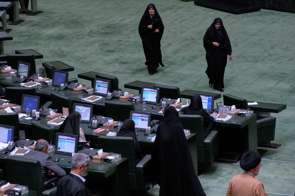 Iranian lawmakers attend an open session of parliament in Tehran, Iran, Sunday, Sept. 28, 2025. (AP Photo/Vahid Salemi)