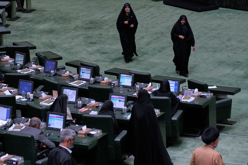 Iranian lawmakers attend an open session of parliament in Tehran, Iran, Sunday, Sept. 28, 2025. (AP Photo/Vahid Salemi) Iranian lawmakers attend an open session of parliament in Tehran, Iran, Sunday, Sept. 28, 2025. (AP Photo/Vahid Salemi)