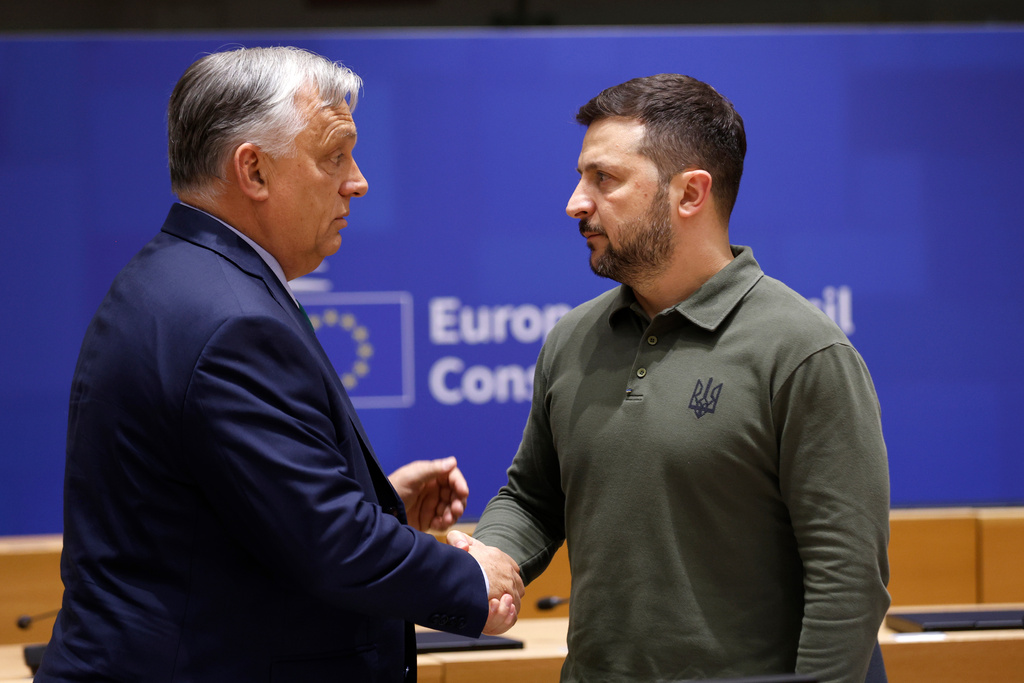 FILE -Hungary's Prime Minister Viktor Orban, left, speaks with Ukraine's President Volodymyr Zelenskyy during a round table meeting at an EU summit in Brussels, June 27, 2024. (AP Photo/Omar Havana, File)