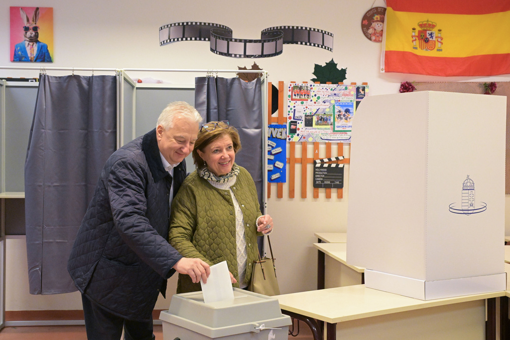 Hungarian Deputy Prime Minister and Chairman of the junior ruling Christian Democratic People's Party (KDNP) Zsolt Semjen and his wife Gabriella Semjenne Menus cast their ballots during an election in Budapest, Hungary, Sunday, April 12, 2026. (Zsolt Szigetvary/MTI via AP)