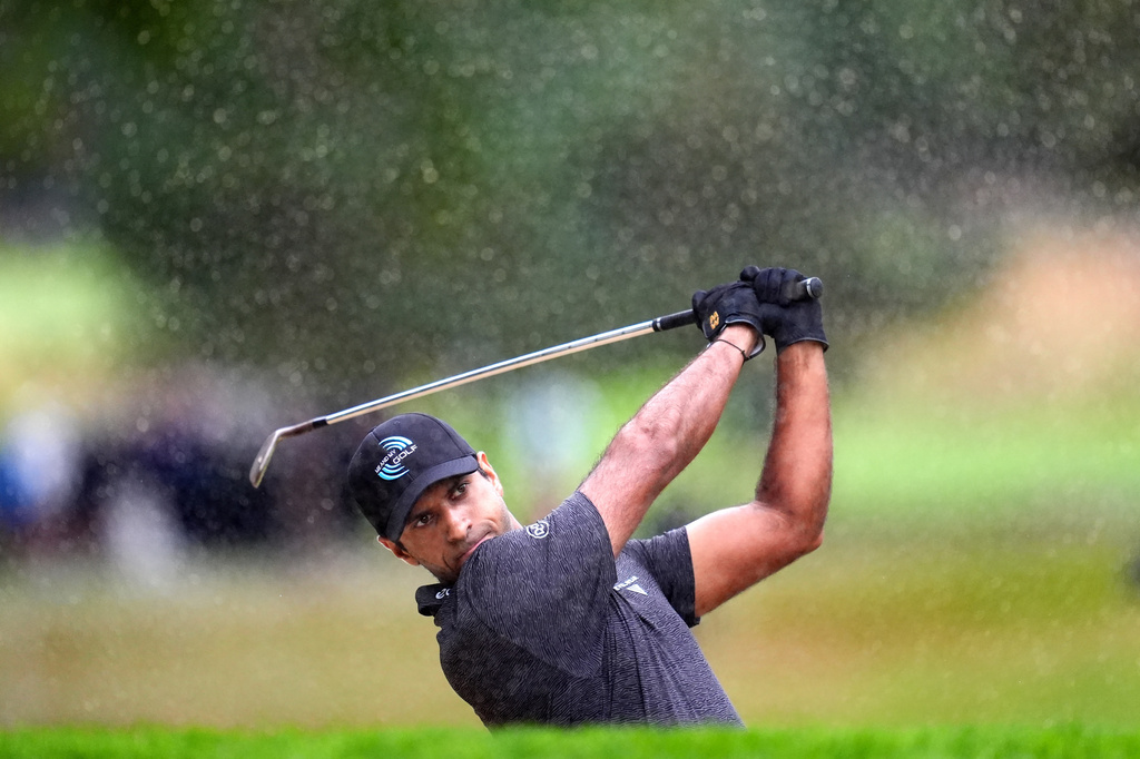 Aaron Rai of England chips from a bunker on day one of the BMW Championship golf tournament at Wentworth Golf Club, in Virginia Water, Surrey, England, Thursday Sept. 17, 2026. (Adam Davy/PA via AP)