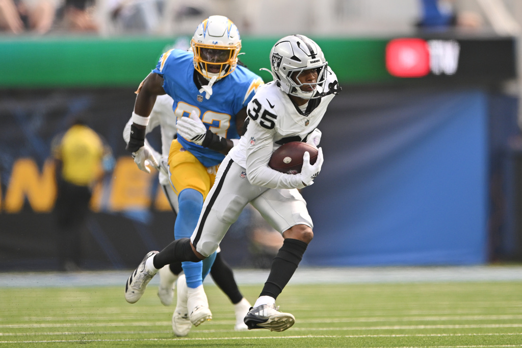 Las Vegas Raiders cornerback Hezekiah Masses (35) intercepts a pass intended for Los Angeles Chargers tight end David Njoku during the first half of an NFL football game in Inglewood, Calif., Sunday, Sept. 20, 2026. (AP Photo/Katie Chin)