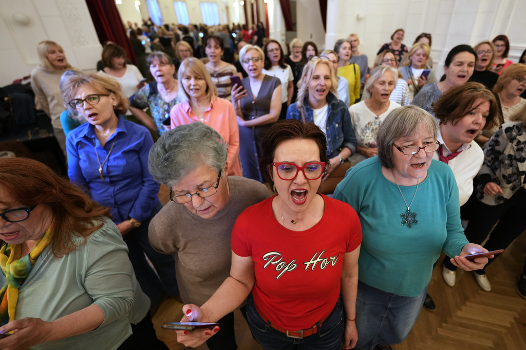 Choir members perform a song during a practice in Belgrade, Serbia, Wednesday, April 15, 2026. (AP Photo/Darko Vojinovic)