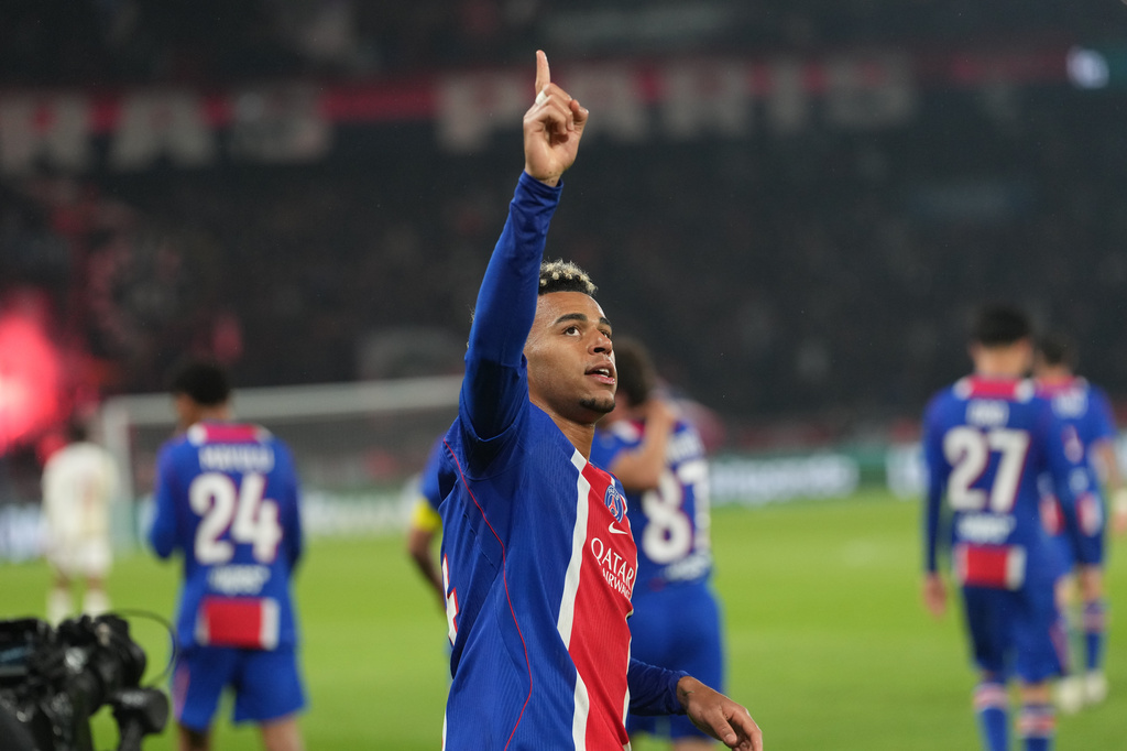 PSG's Desire Doue celebrates scoring his side's opening goal during the French League One soccer match between Paris Saint Germain and Brest in Paris, France, Sunday, May 10, 2026. (AP Photo/Thibault Camus)