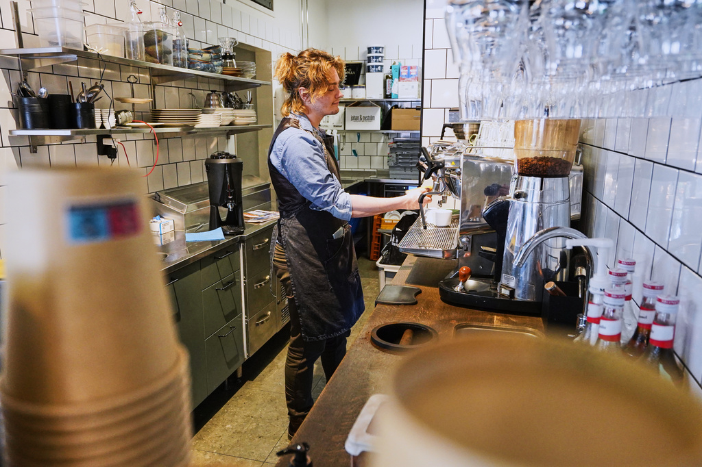 Barista Kajetan Grzelczak makes a coffee at Andon Café at the Vasastan neighborhood in Stockholm, Sweden, Tuesday, May 5, 2026. (AP Photo/James Brooks)