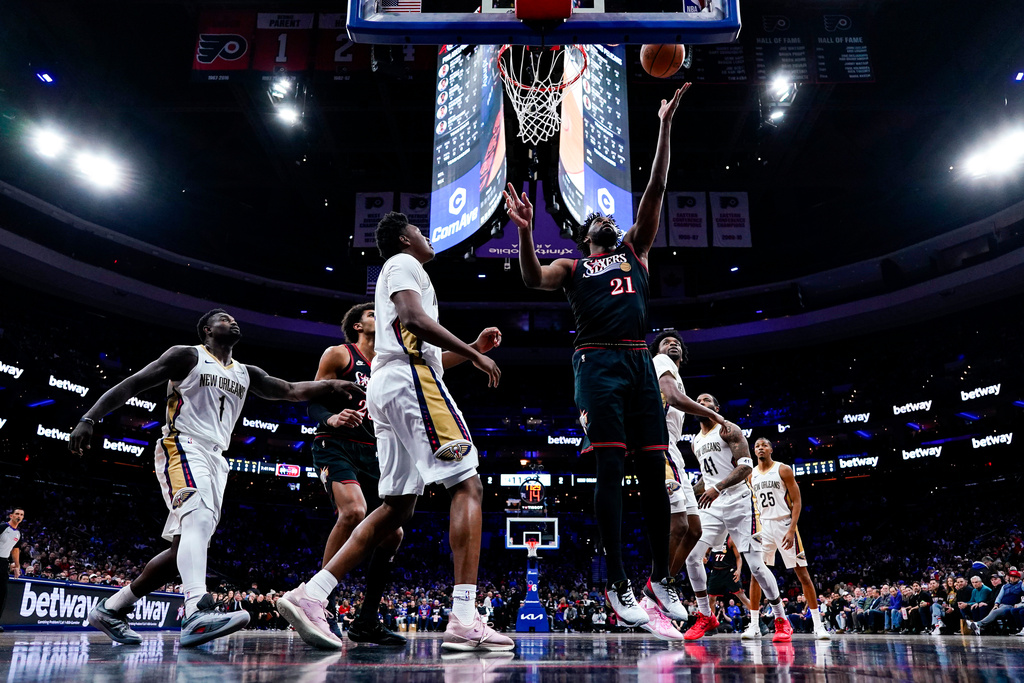 Philadelphia 76ers' Joel Embiid, center right, shoots during the first half of an NBA basketball game against the New Orleans Pelicans, Saturday, Jan. 31, 2026, in Philadelphia. (AP Photo/Chris Szagola)