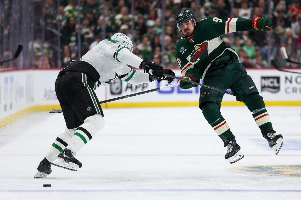 Minnesota Wild left wing Marcus Johansson, right, and Dallas Stars defenseman Nils Lundkvist, left, collide during the third period of Game 4 in the first round of the NHL Stanley Cup hockey playoffs Saturday, April 25, 2026, in St. Paul, Minn. (AP Photo/Matt Krohn)