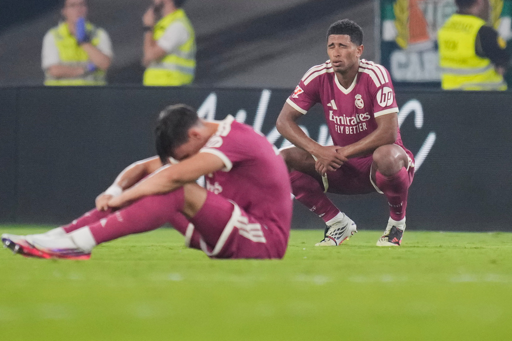 Real Madrid's Jude Bellingham, right, and Carlos Espi react after the Spanish La Liga soccer match between Real Betis and Real Madrid in Seville, Spain, Friday, Sept. 4, 2026. (AP Photo/Jose Breton)