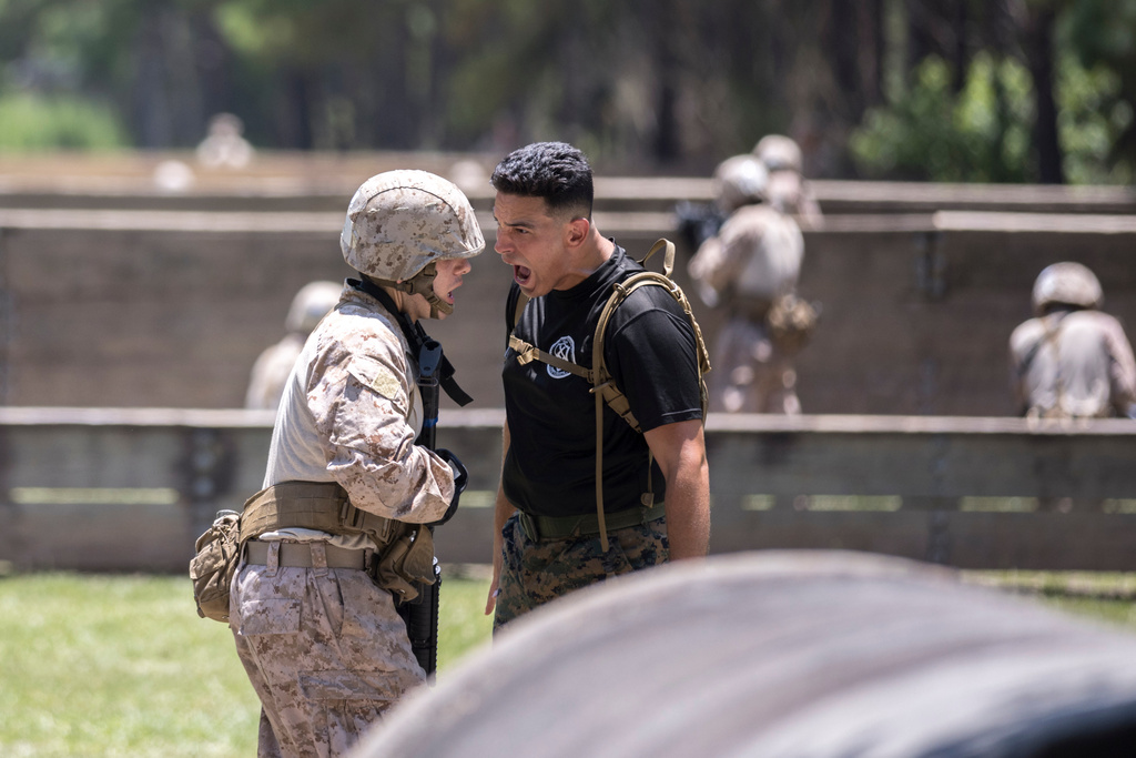 FILE - A U.S. Marine Corps tactical advisors trains a group of recruits during basic warrior training at the Marine Corps Recruit Depot, June 28, 2023, in Parris Island, S.C. (AP Photo/Stephen B. Morton, File)