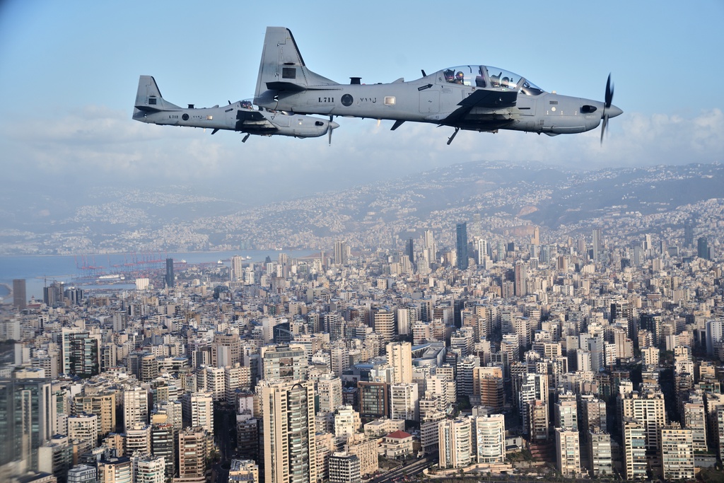 Two Lebanese air force fighters escort Pope Leo XIV's plane as it flies over Beirut, Lebanon, on it's way to the international airport, Sunday, Nov. 30, 2025. (AP Photo/Domenico Stinellis)