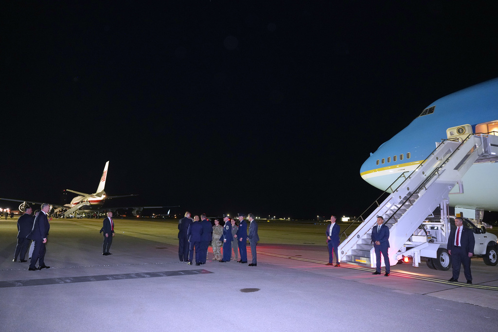 President Donald Trump talks to service members as he switches planes at U.S. Air Force Base, RAF Mildenhall in Suffolk Eastern England, on his way back to Washington from the NATO summit in Ankara, Turkey, Wednesday, July 8, 2026. (AP Photo/Alex Brandon)