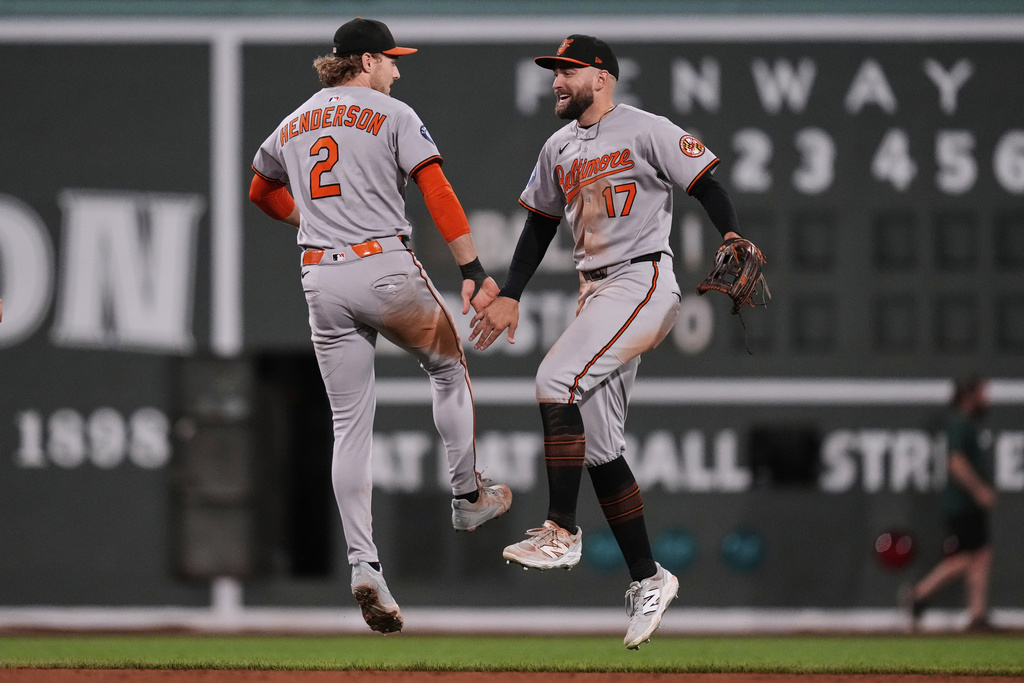 Baltimore Orioles shortstop Gunnar Henderson (2) celebrates with Baltimore Orioles outfielder Colton Cowser after defeating the Boston Red Sox after a baseball game at Fenway Park, Tuesday, Aug. 19, 2025, in Boston. (AP Photo/Charles Krupa)