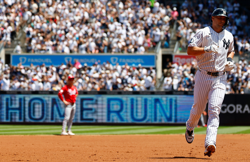 New York Yankees' Paul Goldschmidt runs the bases after hitting a home run against the Cincinnati Reds during the first inning of a baseball game, Saturday, June 20, 2026, in New York. (AP Photo/Noah K. Murray)