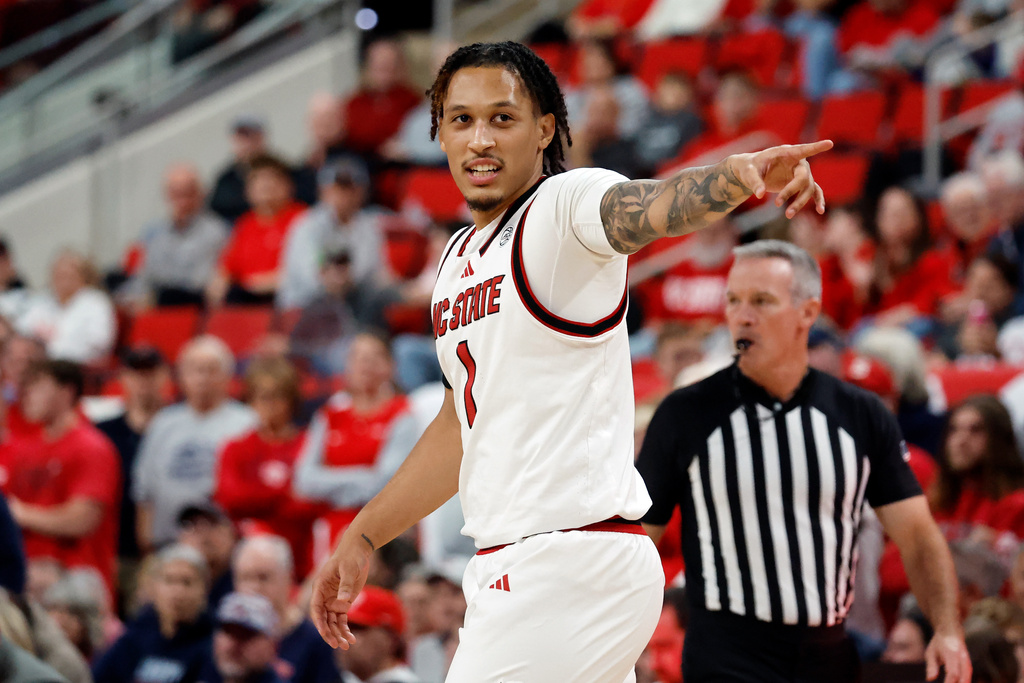 North Carolina State's Darrion Williams (1) celebrates a basket against Liberty during the first half of an NCAA college basketball game in Raleigh, N.C., Wednesday, Dec. 10, 2025. (AP Photo/Karl DeBlaker)