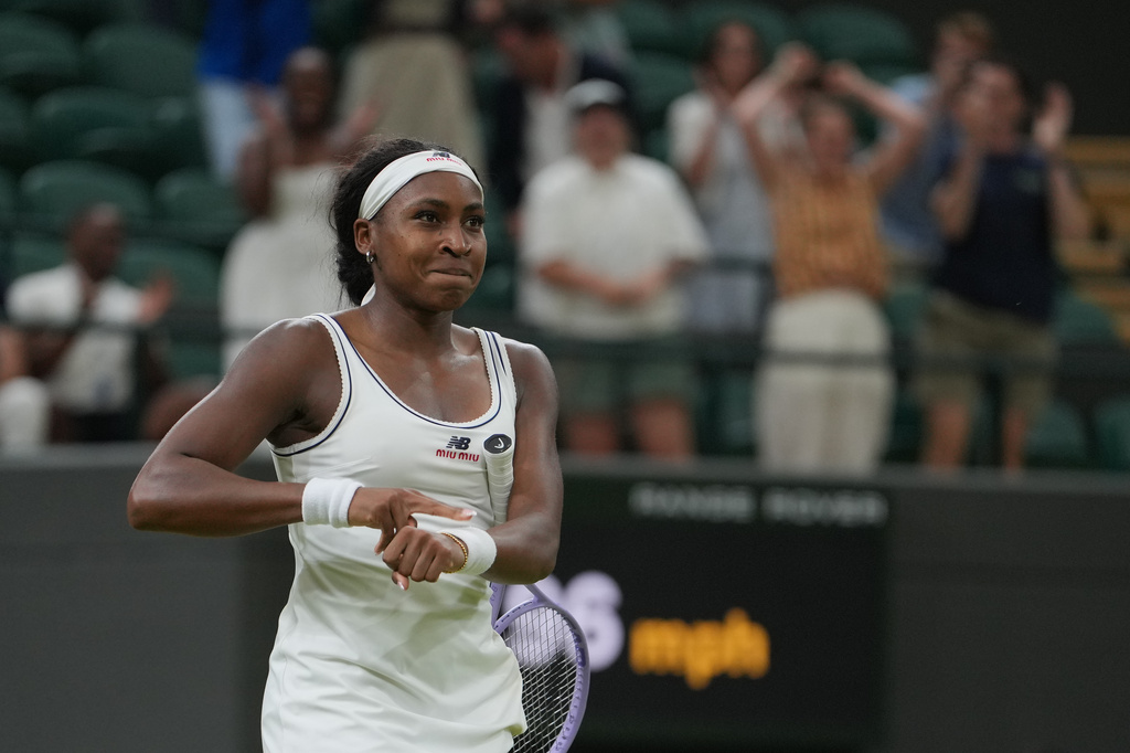 Coco Gauff of the United States reacts after winning against Belinda Bencic of Switzerland in their fourth round women's singles match at the Wimbledon Tennis Championships in London, Sunday, July 5, 2026. (AP Photo/Kin Cheung)