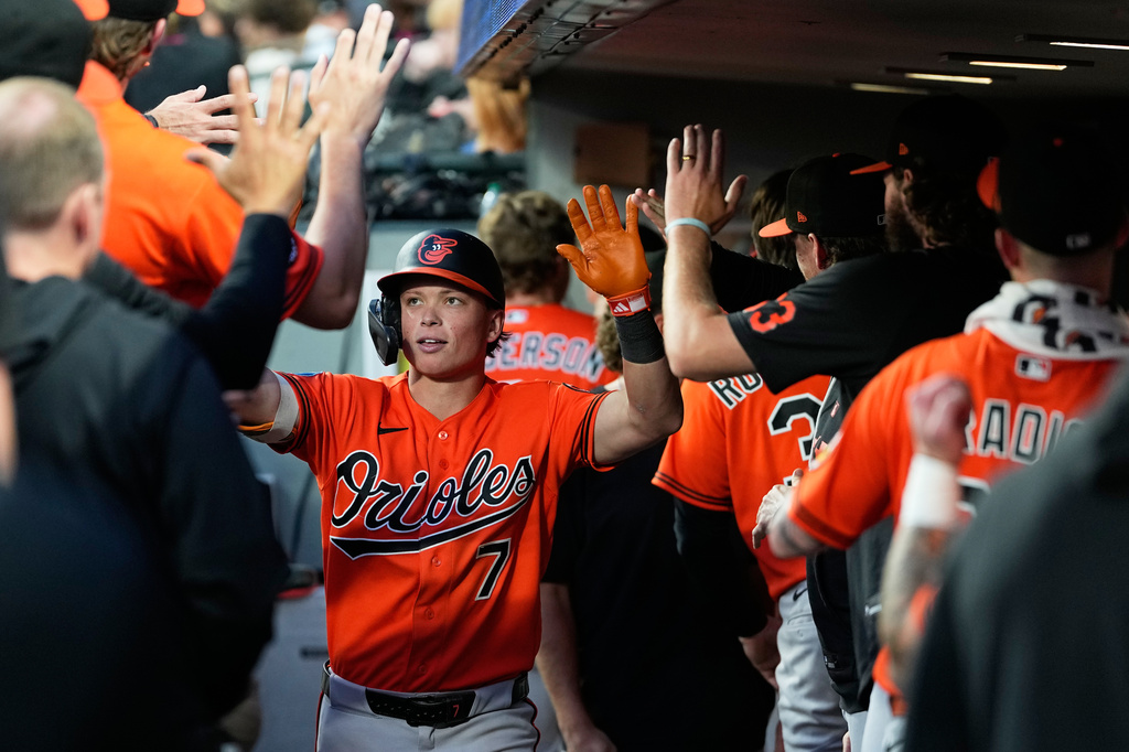 Baltimore Orioles' Jackson Holliday is greeted in the dugout after hitting a solo home run against the Seattle Mariners during the ninth inning of a baseball game, Wednesday, June 17, 2026, in Seattle. (AP Photo/Lindsey Wasson)