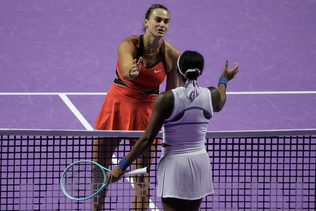 Aryna Sabalenka of Belarus, left, greets her opponent Coco Gauff of the United States after winning the women's singles match at the WTA tennis finals in Riyadh, Saudi Arabia, Thursday, Nov. 6, 2025. (AP Photo/Fatima Shbair)