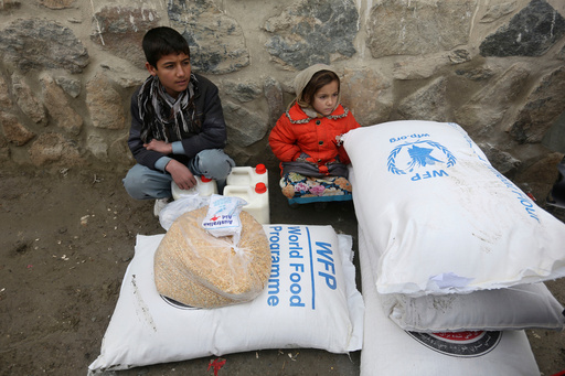FILE - Children wait for transportation after receiving food donated by the World Food Program, in Kabul, Afghanistan, Jan. 24, 2017. (AP Photo/Rahmat Gul, File) FILE - Children wait for transportation after receiving food donated by the World Food Program, in Kabul, Afghanistan, Jan. 24, 2017. (AP Photo/Rahmat Gul, File)