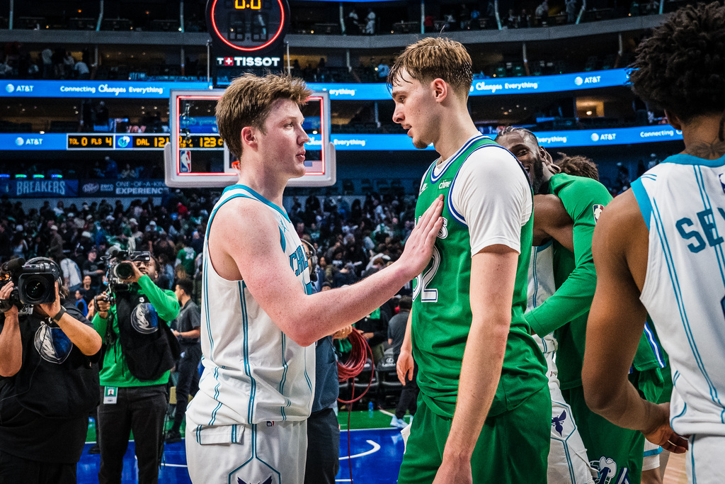 Dallas Mavericks forward Cooper Flagg, right, and Charlotte Hornets guard Kon Knueppel, left, talk after an NBA basketball game, Thursday, Jan. 29, 2026, in Dallas. (AP Photo/Jessica Tobias)