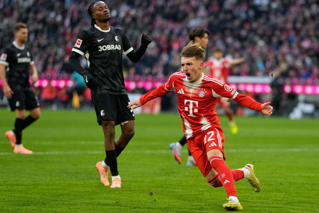 Bayern's Lennart Karl celebrates after scoring during the Bundesliga soccer match between Bayern Munich and Freiburg in Munich, Saturday, Nov. 22, 2025.(AP Photo/Matthias Schrader)