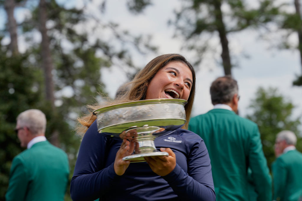 Maria José Marin, of Colombia, holds the trophy after winning the Augusta National Women's Amateur golf tournament, Saturday, April 4, 2026, in Augusta, Ga. (AP Photo/David J. Phillip)
