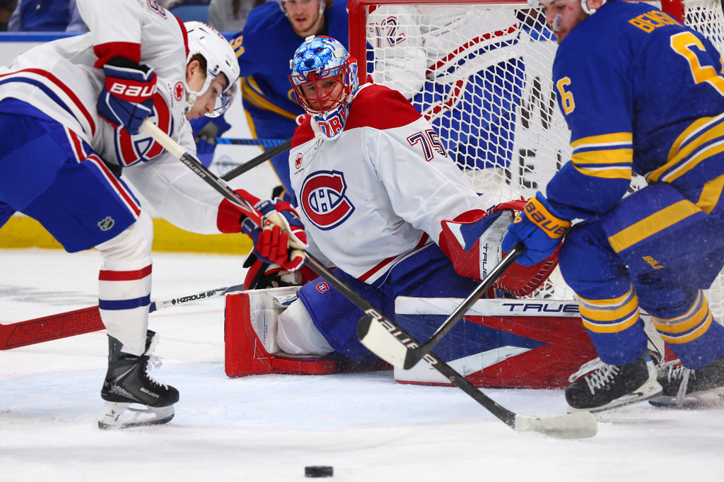 Montreal Canadiens goaltender Jakub Dobes (75) watches the puck during the first period in Game 2 of a second-round NHL hockey Stanley Cup playoff series against the Buffalo Sabres, Friday, May 8, 2026, in Buffalo, N.Y. (AP Photo/Jeffrey T. Barnes)