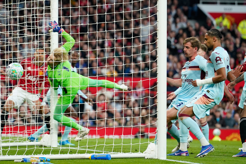 Brentford's goalkeeper Caoimhin Kelleher fails to save first goal during the Premier League soccer match between Manchester United and Brentford in Manchester, England, Monday, April 27, 2026. (AP Photo/Dave Thompson)