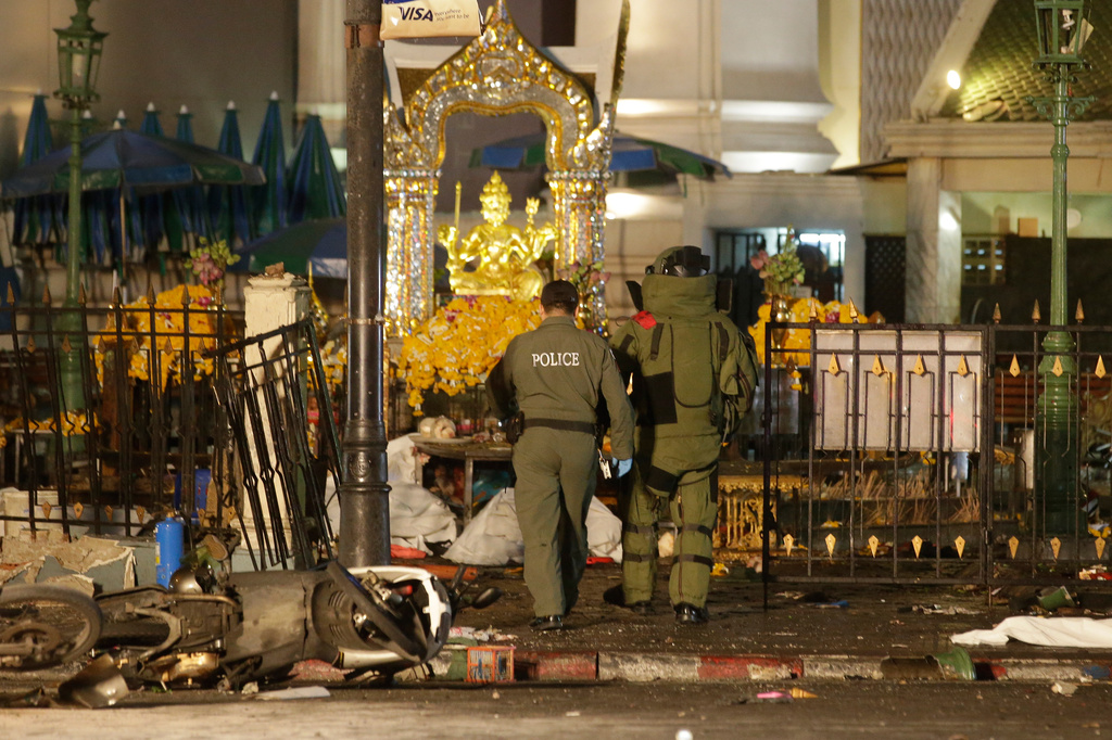 FILE - Explosive Ordnance Disposal officers enter the Erawan Shrine after an explosion in Bangkok, on Aug. 17, 2015. (AP Photo/Sackchai Lalit, File)