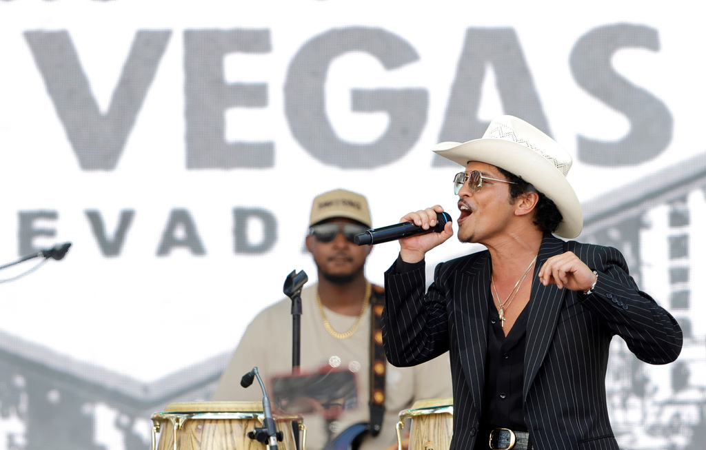 Bruno Mars performs for fans in Toshiba Plaza after a parade down the Las Vegas Strip Friday, April 10, 2026, in Las Vegas, on "Bruno Mars Day." (Steve Marcus/Las Vegas Sun via AP)