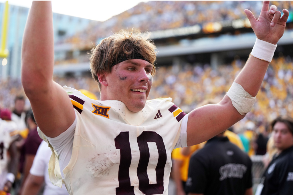 Arizona State quarterback Sam Leavitt (10) celebrates after defeating Texas Tech during an NCAA college football game Saturday, Oct. 18, 2025, in Tempe, Ariz. (AP Photo/Rick Scuteri)