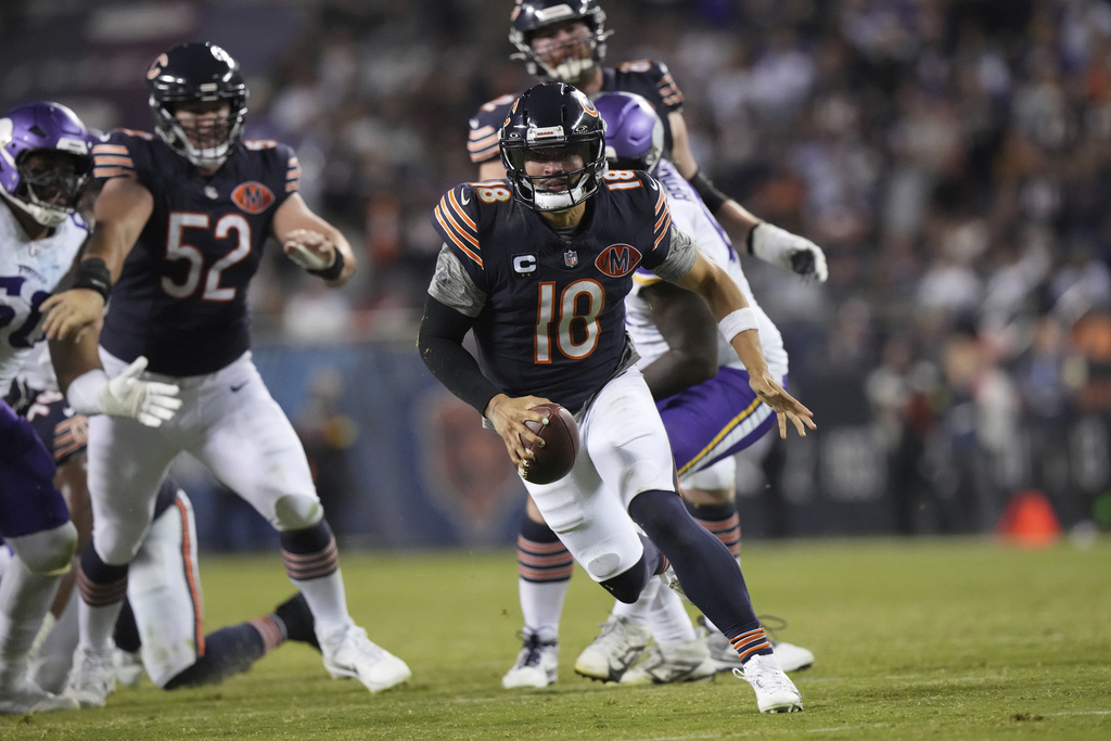 Chicago Bears quarterback Caleb Williams runs with the ball during the second half of an NFL football game against the Minnesota Vikings Monday, Sept. 8, 2025, in Chicago. (AP Photo/Nam Y. Huh)