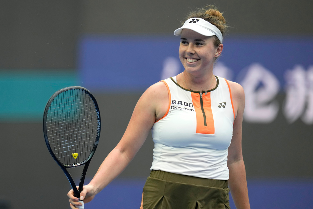 Linda Noskova of the Czech Republic reacts after defeating Sonay Kartal of Britain in a women's singles quarterfinal match of the China Open tennis tournament in Beijing, China, Friday, Oct. 3, 2025. (AP Photo/Ng Han Guan)